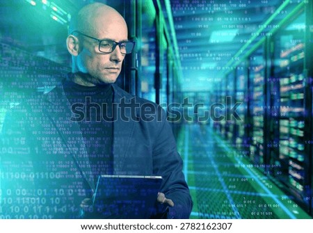 Data center engineer monitors server infrastructure with tablet, binary code overlay, and cybersecurity network systems