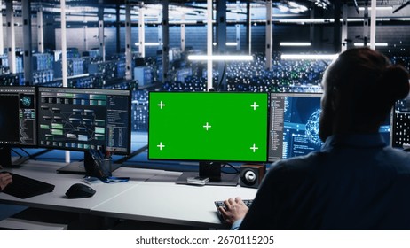 Data center engineer using green screen PC to monitor neural network using AI. IT expert at work using artificial intelligence on mockup computer to oversee servers powering deep learning, camera A