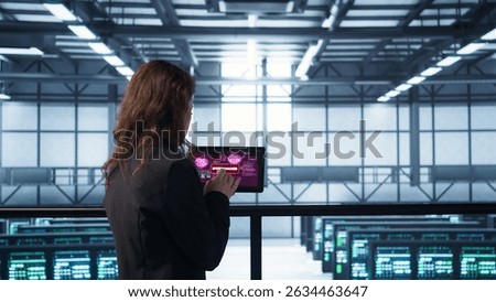 Data center engineers struggling to contain virus infestation, working on securing servers. Team of server farm employees detecting hacker attacks on tablet, fighting back, camera B