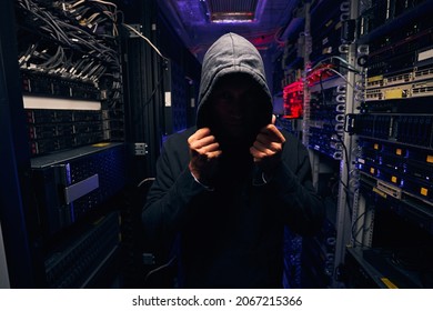 Data center intruder trying to cover his face