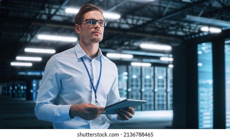 Data Center Male e-Business Entrepreneur Use Tablet Computer. Information Technology Professional on Bridge Overlooking Big Cloud Computing Server Farm. Analytics Concept - Powered by Shutterstock