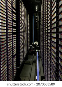 Data center with multiple rows of fully operational server racks. modern cloud computing technology concept.