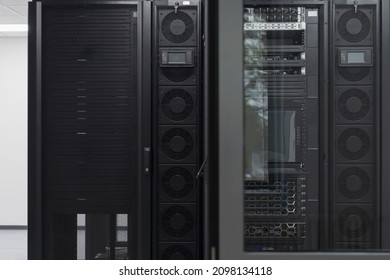 Data Center With Multiple Rows of Fully Operational Server Racks. Modern Telecommunications, Cloud Computing, Artificial Intelligence, Database, Supercomputer Technology Concept.