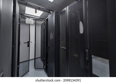 Data Center With Multiple Rows of Fully Operational Server Racks. Modern Telecommunications, Cloud Computing, Artificial Intelligence, Database, Supercomputer Technology Concept.