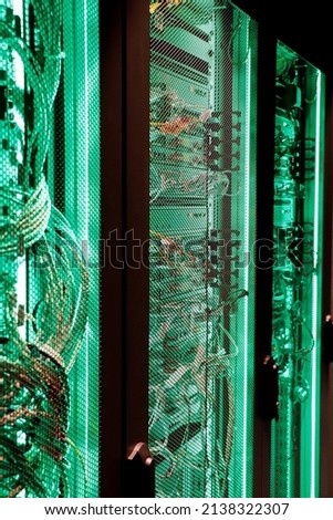 Data Center With Multiple Rows of Fully Operational Server Racks in server room. Cloud database, super Computer Technology