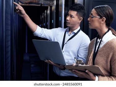 Data center, people and laptop with checklist, collaboration and safety as computer engineer. Team, technician and technology for hardware, security and server room for system update or maintenance - Powered by Shutterstock