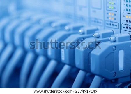 Data center server room with network cables and led indicators.