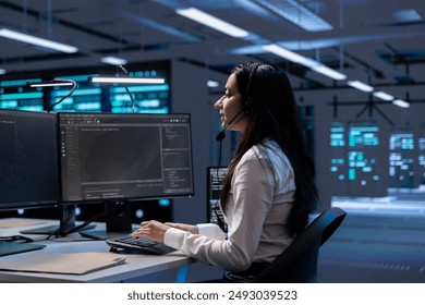 Data center support expert supporting engineering team doing equipment maintenance, talking in headset microphone. Woman in server farm coordinating technicians using mic
