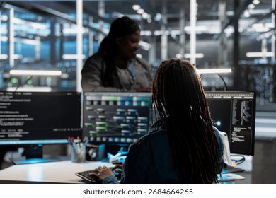 Data center system administrator using artificial intelligence neural networks tech and node trees. Server farm employee using AI programming language on computer, configuring specialized hardware