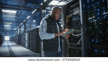 Data center technician inspects server racks, checks network cables, and uses a tablet to monitor hardware status. Rows of illuminated servers, digital infrastructure, and secure network operations.