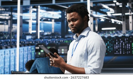 Data center technician uses node tree programming interface to identify equipment performance issues. Engineer reviews data analysis graph in server hub to minimize hardware failures, camera B