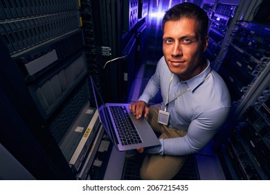 Data center IT worker posing for camera at work