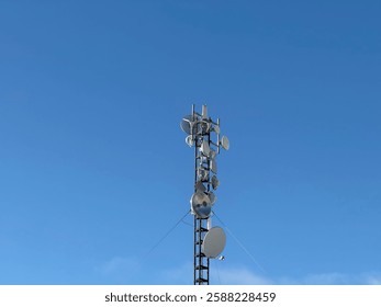 Data communication tower on the building roof, 5g tower, mobile data transfer  