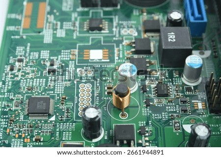 Data controller chip, resistors, capacitors on a computer motherboard.