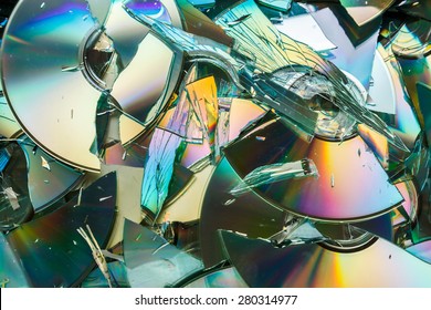 Data Destruction: Stack Of Broken CD And DVD Disks