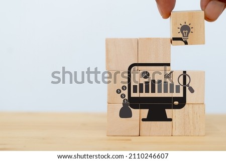 Data driven marketing concept.  Analysis market strategy, personalized and contextual marketing. Marketing technology. Man puts wooden cubes with data driven icon on white background and copy space.