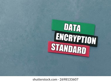 Data encryption standard words on color paper pieces