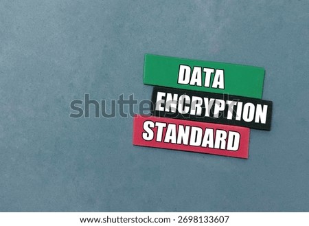 Data encryption standard words on color paper pieces