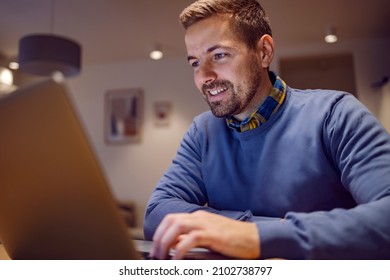 Data Entry And Software Develop Remote Jobs. A Happy Senior Developer Is Sitting At His Home, Working Remotely And Typing Code On His Laptop.