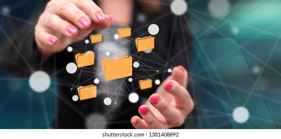 Data exchange concept between hands of a woman in background