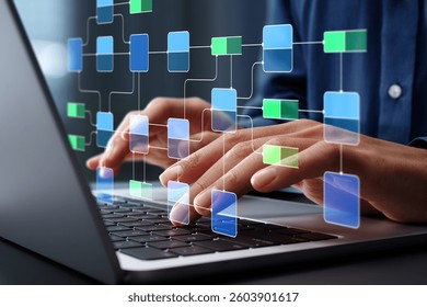 Data flow diagram. Process decomposition and data flow analysis. Engineer using laptop computer to manage data processing system.