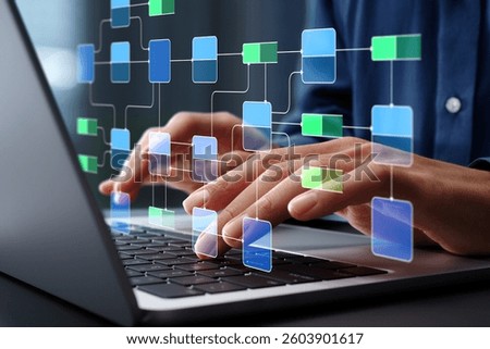 Data flow diagram. Process decomposition and data flow analysis. Engineer using laptop computer to manage data processing system.