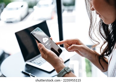 Data information concept, Young woman waiting for cloud uploading on smartphone.