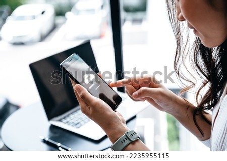 Data information concept, Young woman waiting for cloud uploading on smartphone.