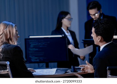 Data integrity check night shift Diverse team meticulously audits financial performance comparing figures tablet screen printed reports ensuring accuracy crucial validation process underway hub.