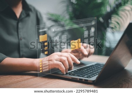 Data management and document network system concept, Businessman use laptop search for documents in online archives ,Document management Storage and technology on digital document paperless operation