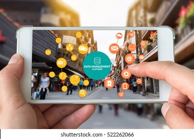 Data Management Platform (DMP) , Marketing And Crm Concept. Hand Holding Smart Phone , Infographic , Texts And Icons On Retail Shopping Store City Shop Background.