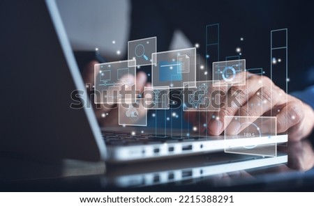 Data Management System. Analyst working with business Analytics documents on computer to make report with KPI and connected to database. Corporate strategy for finance, business operations