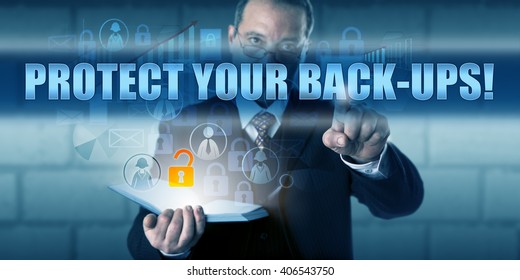 Data manager is pressing PROTECT YOUR BACK-UPS! on a virtual touch screen interface. Business risk metaphor and information technology concept for security of your backed-up corporate data.