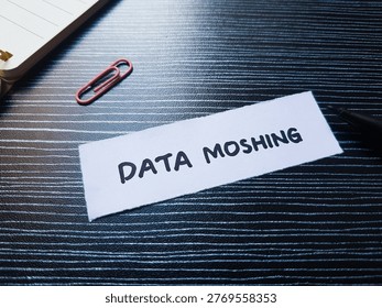 Data moshing writting on table background. 