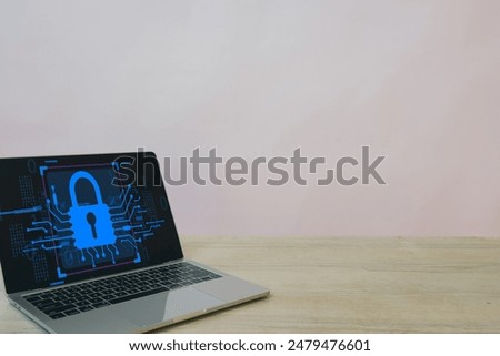 Data Privacy,Cybersecurity,Information security,Secure networks,Digital information concept.,Laptop on a table with a blank screen featuring a digital padlock and cyber security network icon.