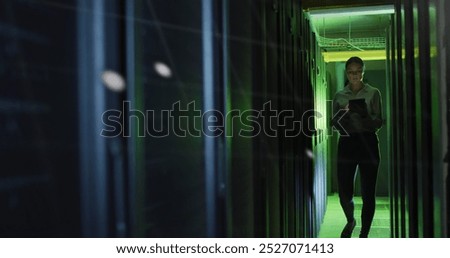Data processing against caucasian female engineer with digital tablet working in server room. Business data storage technology concept