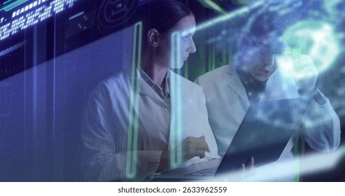 Data processing against diverse male and female engineers using laptop at computer server room. Business data storage technology concept