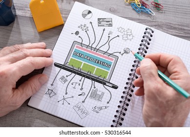 Data processing concept drawn on a notepad placed on a desk