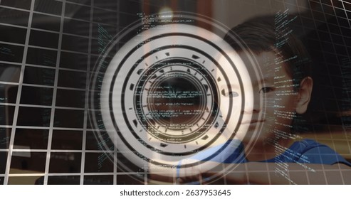 Data processing over round scanner over portrait of asian boy using computer at school. School and education technology concept