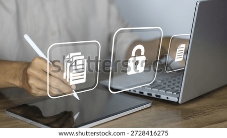 Data protection and cybersecurity concept featuring a professional using a stylus on a digital tablet alongside a laptop to manage sensitive information. The image highlights digital document security with floating glass icons representing file organization, encrypted lock protection, and secure data storage. This visual illustrates modern business privacy standards, GDPR compliance, and the importance of securing personal or corporate data in a hybrid work environment. The person is shown signing or editing documents electronically, emphasizing safe digital workflows and the integration of technology in maintaining information confidentiality