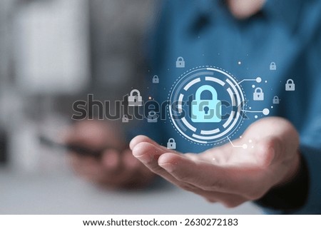 Data protection and cybersecurity concept, internet network security online. Businessman holding digital lock icon for symbolizing cybersecurity.