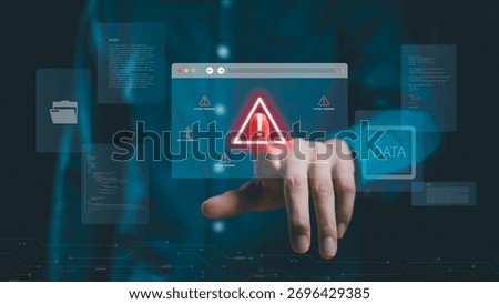 Data protection and cybersecurity system warning alert. Business hand touching a holographic warning icon, data breach, malware attack, digital security, and technology protection.
