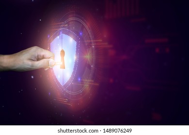 Data protection and network security concept. Glowing light Shield on business man hand for internet fire wall protect, insurance, or computer virus cleaner.
