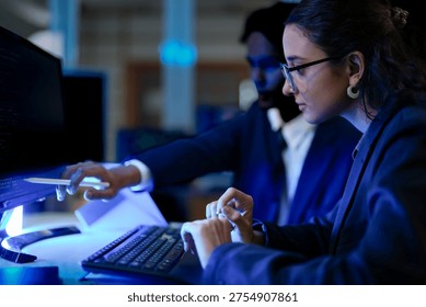 Data science professionals evaluating algorithmic machine learning models. Female tech analyst programming artificial intelligence neural networks code.