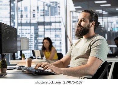 Data scientist doing software quality assurance, reading source code on computer before implementing it. IT employee in office inspecting coding on PC device, looking to fix potential issues
