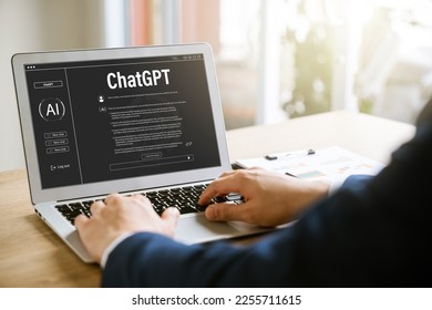 Data search concept using artificial intelligence chatbot ChatGPT, young businessman chatting with smart chatbot To find business economic information, artificial intelligence developed by OpenAI. - Powered by Shutterstock