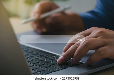 Data Search Technology Search Engine Optimization (SEO). Man hands typing on laptop computer keyboard with a blank search bar to search the information.internet technology for business company.