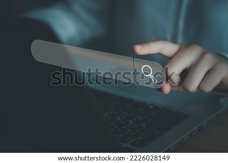 Data Search Technology Search Engine Optimization (SEO). Woman's hands are touch on virtual search bar for surfing the internet and Searching for information on web browser.