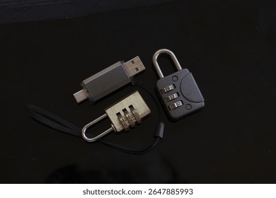 data security measures concept with usb flash drive and combination padlocks