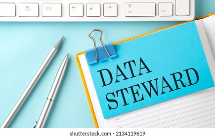 DATA STEWARD Text On The Sticky On Notebook With Pen And Keyboard. Business Concept